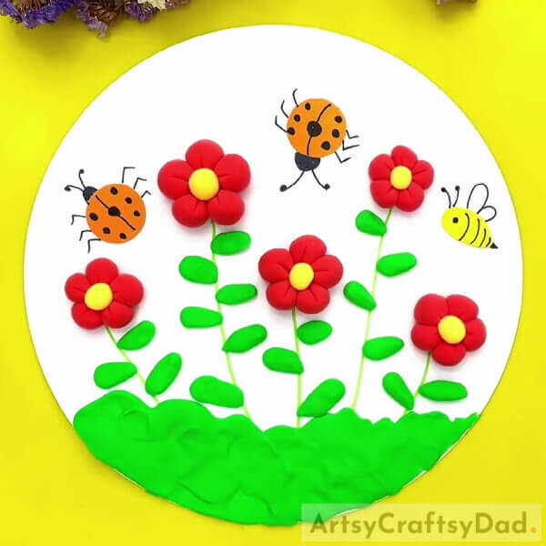 This Is The Final Look Of Your Clay Red Flower Graden Craft!- A ceramic project of a garden with bees and beautiful flowers.