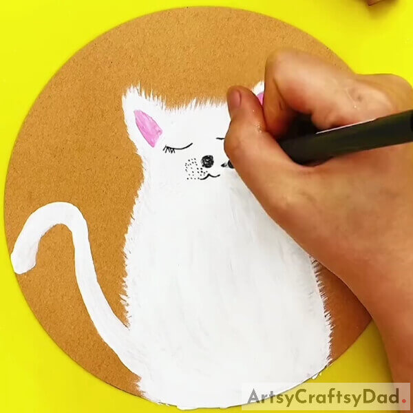 Add features to the face of the cat - Guide to Help Kids Paint Furry Cats