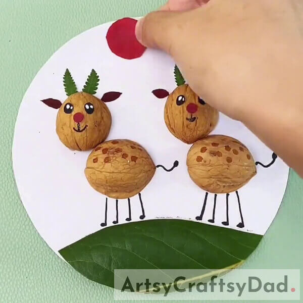 Adding A Sun In The Scenery- Learn to Craft a Deer Landscape with Walnut Shells and Leaves