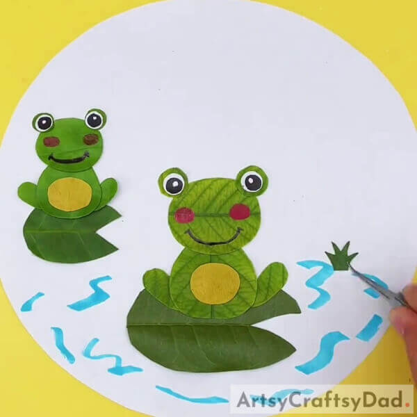 Adding Grass In The Pond- Crafting a leaf frog pond vista for children.