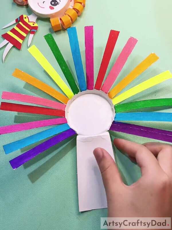 Coloring The Thin Strips- A Tutorial For Little Ones With Curly Hair To Make A Creative Paper Cup Art Piece