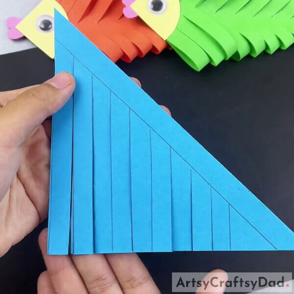 Completing Cutting Along The Lines - Crafting a fish with paper