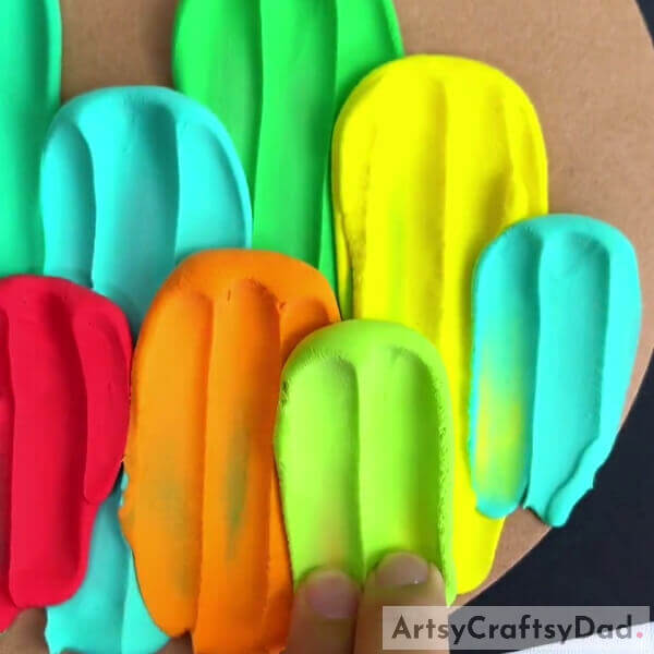 Completing MakingThe Cactuses- Fabulous Colorful Clay Cacti Activity Guide For Little Ones 