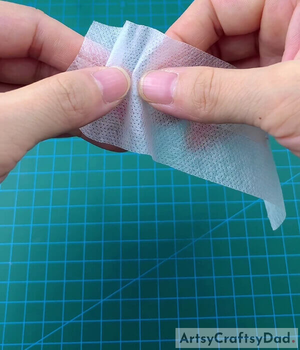 Creating Pleats With Thin Layer Of Mask- Check out this tutorial for making a pocket for a surgical mask.