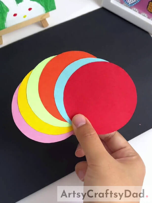 Cutting Out Circles - Step-by-step instructions for a fun paper pinwheel flower craft for children 
