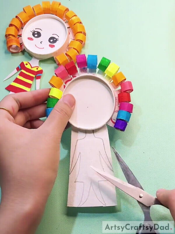 Cutting Out The Girl's Body- Step-By-Step Guide To Create A Paper Cup Craft For Kids With Curly Hair