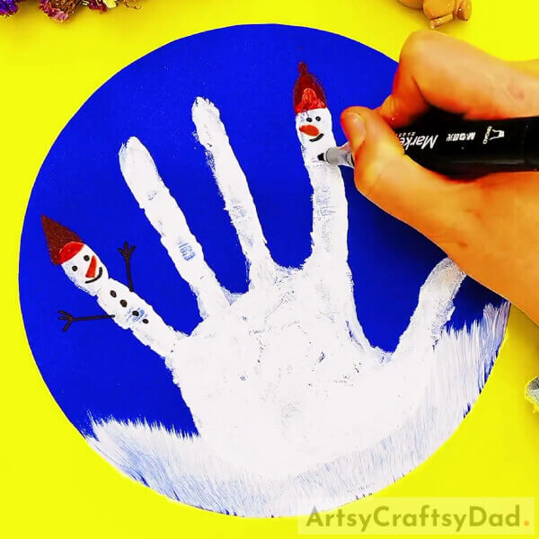 Draw The Second Snowman Face On Fingers- A Guide for Kids to Make a Snowman Using Handprints