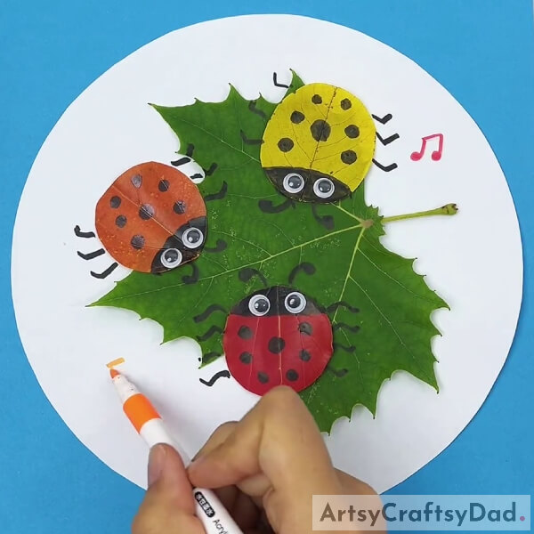 Drawing Music Symbol pattern Around Ladybugs- Tutorial on Ladybugs and Leaves Art