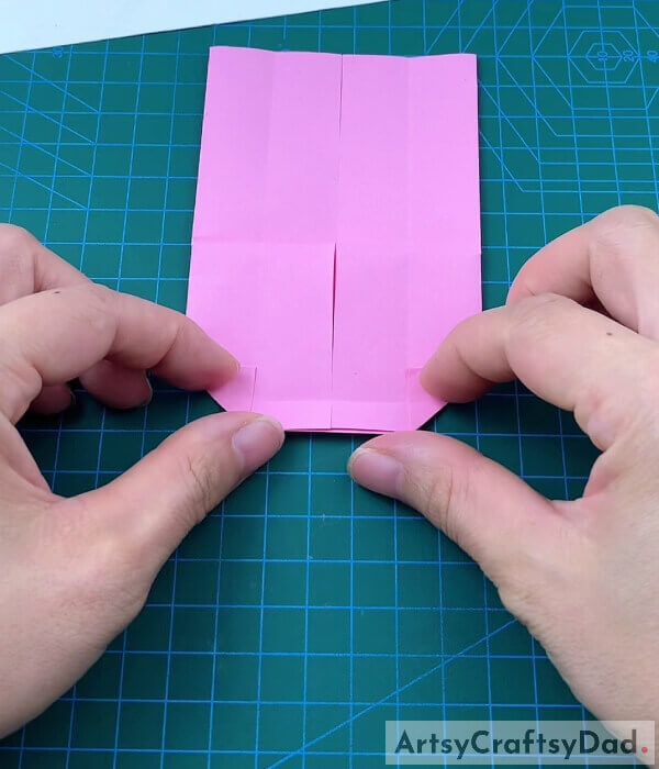 Fold the Corners - An instructional tutorial on how to create a paper bed and pillow using origami for children