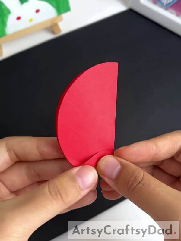 Folding The Edge Of The Folded Circle - A kid-friendly tutorial for crafting a paper pinwheel flower 