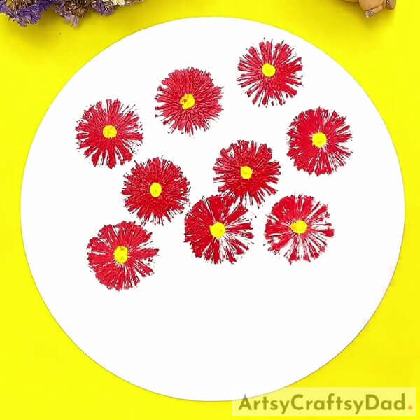 Give each flower a yellow centre- A tutorial designed for kids to learn how to make a stamp painting with red vector flowe