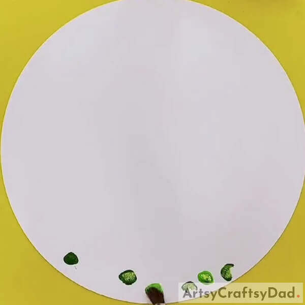 Make finger imprints on the lower side, using dark green paint - Techniques for Creating Handprint Chicken Art