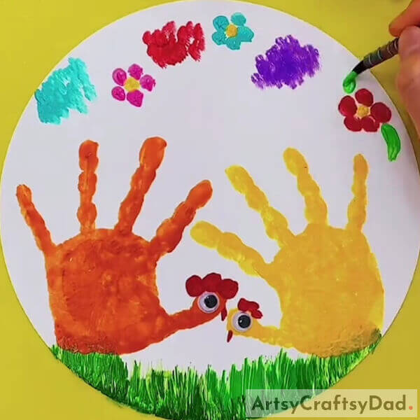 Make the leaves around the flowers - Step-by-Step Guide to Making Handprint Chicken Paintings