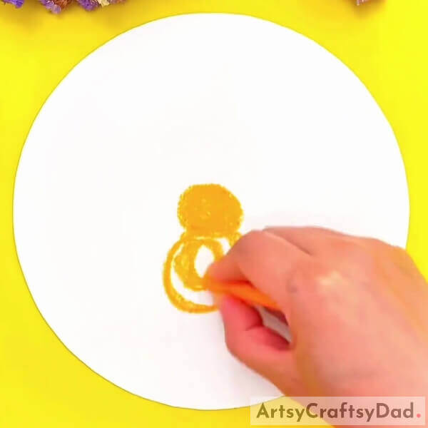 Make two circles from saffron-colored oil pastel - Guidance on creating oil pastel artwork of fluffy chicks for children