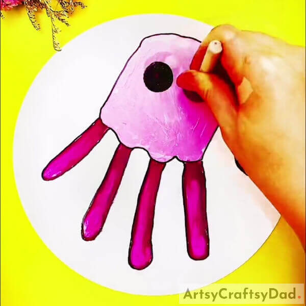 Making An Eye With Stamping Black Paint -Learn to Create a Jellyfish Artwork with Handprints