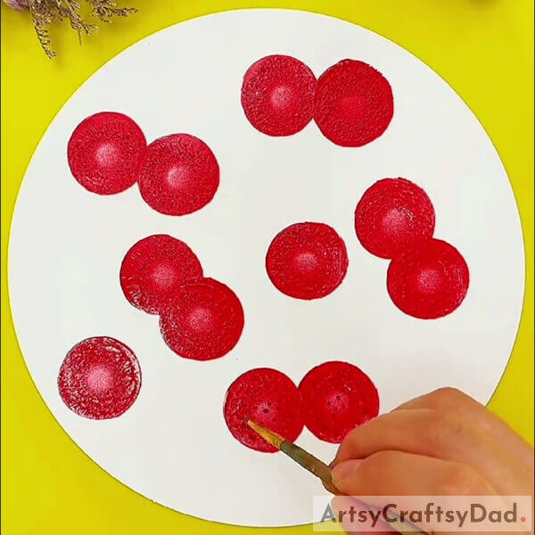 Making Dots Over The Cherries - A guide to making a stamp artwork of cherries on a tree limb 