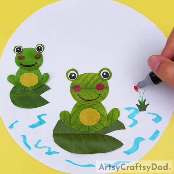 Making The Plant- Creating a water-filled habitat with lily pads for kids featuring leaf frogs.