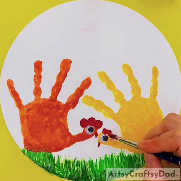 Now, do the same with the other hen as well - Tricks to Create Handprint Chicken Paintings