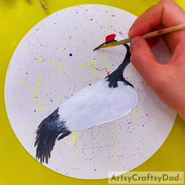 Paint some red paint beside the beak and above the black - A Tutorial to Assist Beginners in Painting a Realistic Crane Bird 