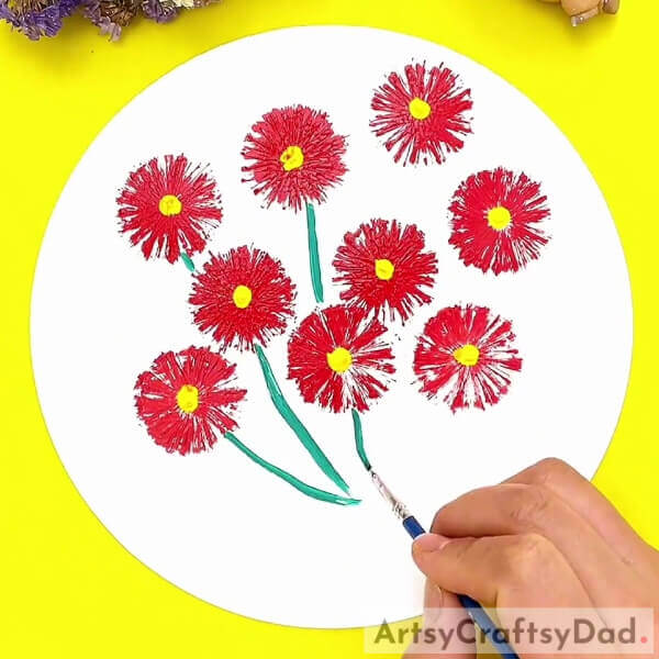 Painting The Stems Of The Flowers- Learn how to craft a stamp painting of red vector flowers - a tutorial for kids.