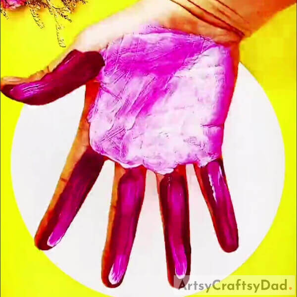 Painting Your Palm Hand With Light Pink Color - How to make a Jellyfish Artwork using Handprints