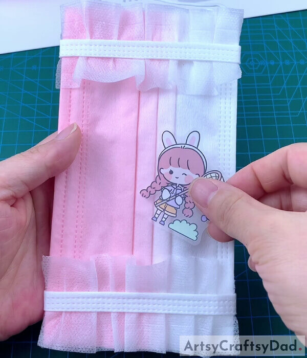 Pasting Cute Stickers With Our Surgical Mask- Get the tutorial for creating a pouch for a facial covering.