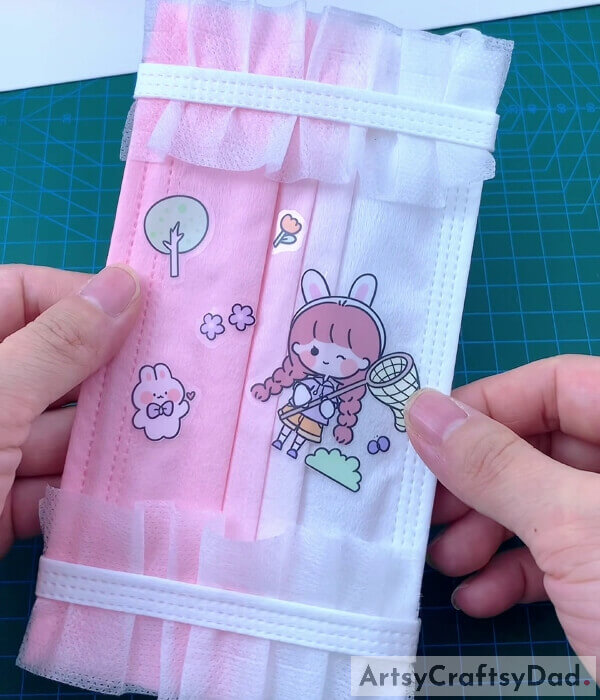 Pasting More Stickers For Decoration- Learn the steps for making a pocket for a surgical mask.