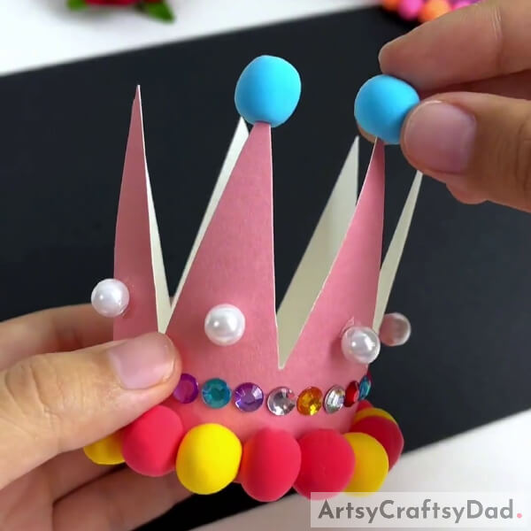 Pasting Pearls And Blue Color Clay On Crown- How-to Tutorial for Beginners on Paper Cup and Clay Crowns 