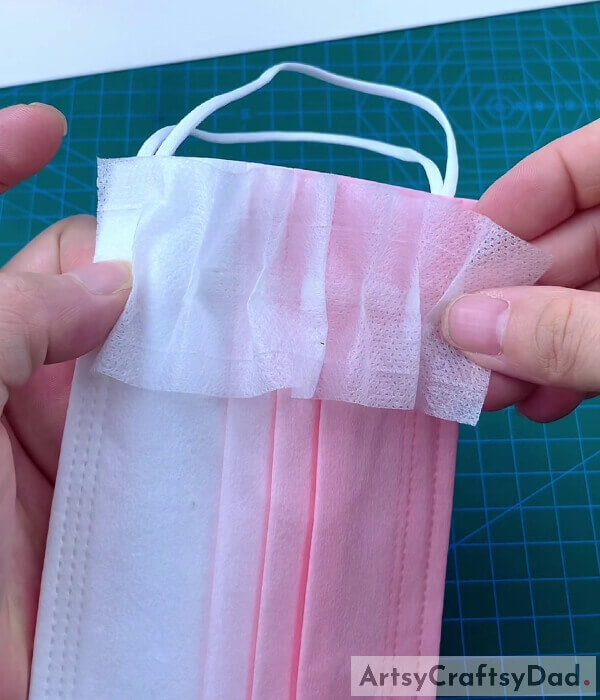 Pasting That Piece Of The Mask With The Pouch- Get the instructions for making a pouch for a surgical mask.