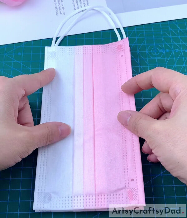 Pasting Two Masks Together- Find out how to construct a pouch for a face covering.