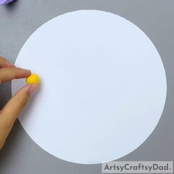 Pasting Yellow Clay On White Construction Paper- Clay Autumn Circular Trees Artwork Guide