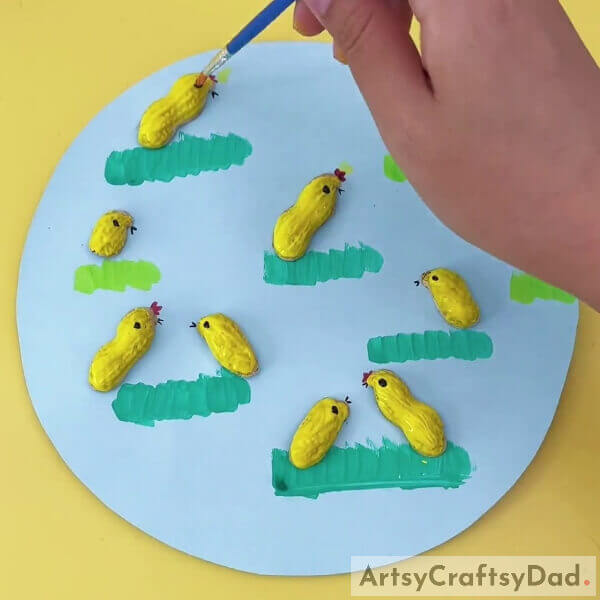 : Putting Black Dot For Each Shell To Make Chick's Eyes- Peanut Shell Chicks DIY for Kids
