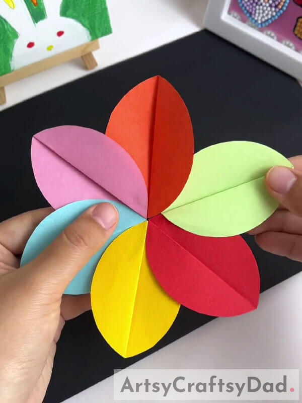 Securing The Last Petal - A tutorial for parents to craft a paper pinwheel flower with their children 