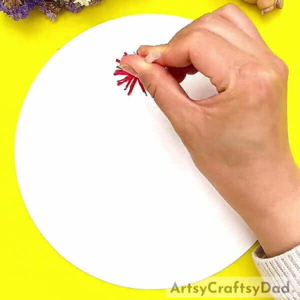 Stamping The Flowers On The Paper- Kids can learn how to craft a stamp painting of red vector flowers.