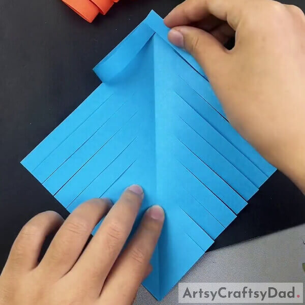Sticking the Strips To The Middle - Step-by-step guide to creating a paper fish