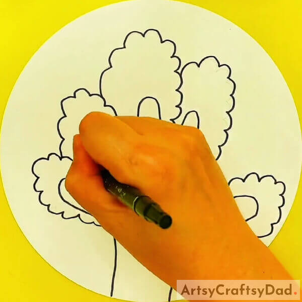 Trace the bushed you made in the previous step - Learn the Technique of Drawing Trees with Hand Outlines for the Little Ones 