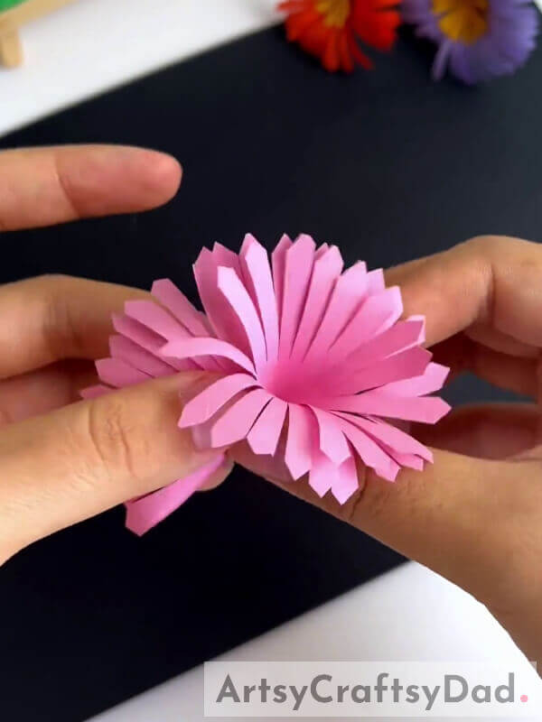 Applying Glue And Pasting Flower- Crafting Artificial Flowers Through Paper Cutting Explained