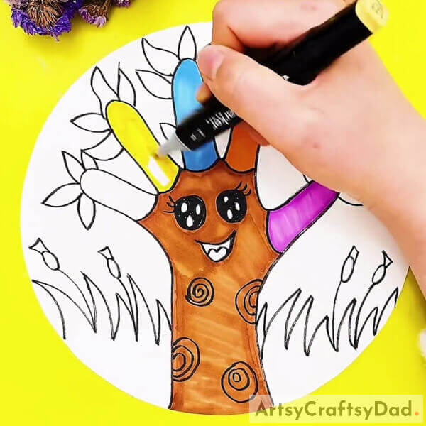 Coloring The Branches- An instructional guide for novices on creating a delightful tree with a hand outline. 