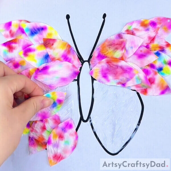 Completing Pasting The Petals- Tissue Paper and a Pen Hacks for Crafting a Colorful Butterfly