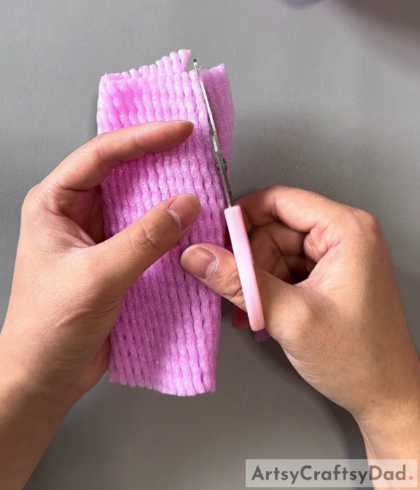 Cutting A Strip- Learn How to Construct a Flower Basket with Fruit Foam Net and Plastic Bottle
