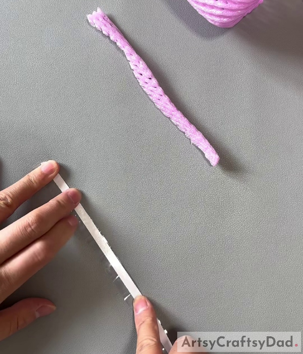 Cutting A Strip From The Plastic Bottle-Making a Flower Basket Out of Fruit Foam Net and Plastic Bottle