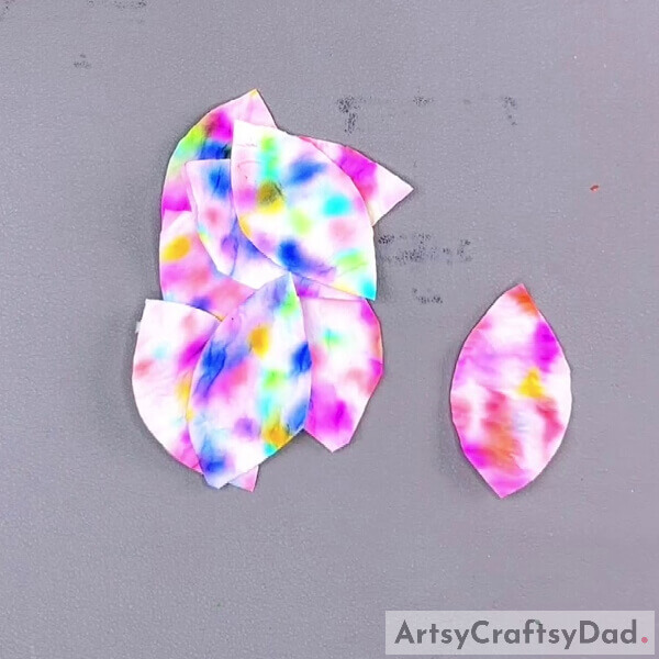 Cutting Out Petals Shapes- Step-by-Step Instructions on How to Create a Colorful Butterfly Using Tissue Paper and a Sketch Pen