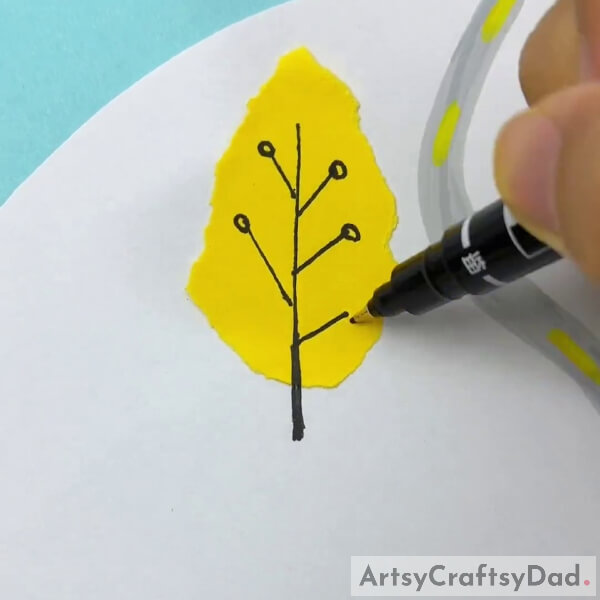 Drawing Branches On Our Yellow Craft Paper- Paper shredding craft in a woodland: a tutorial.