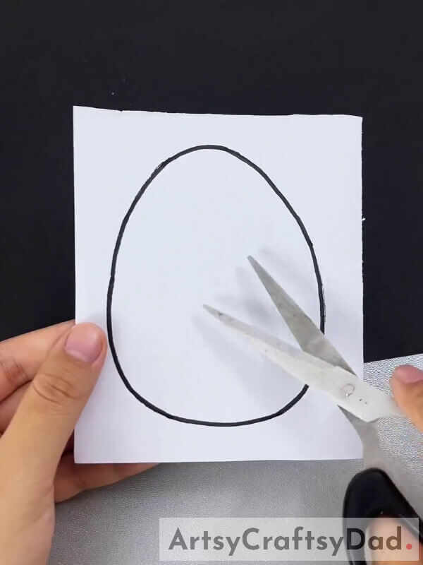 Drawing Egg On White Craft Paper-Create a Paper Craft Project With Chick Hatch For Children 