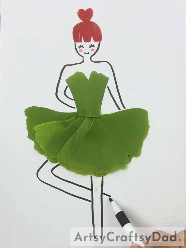 Drawing Eyes, Mouth, And Legs For The Girl- Tutorial For Crafting A Lovely Leaf Dress For Kids
