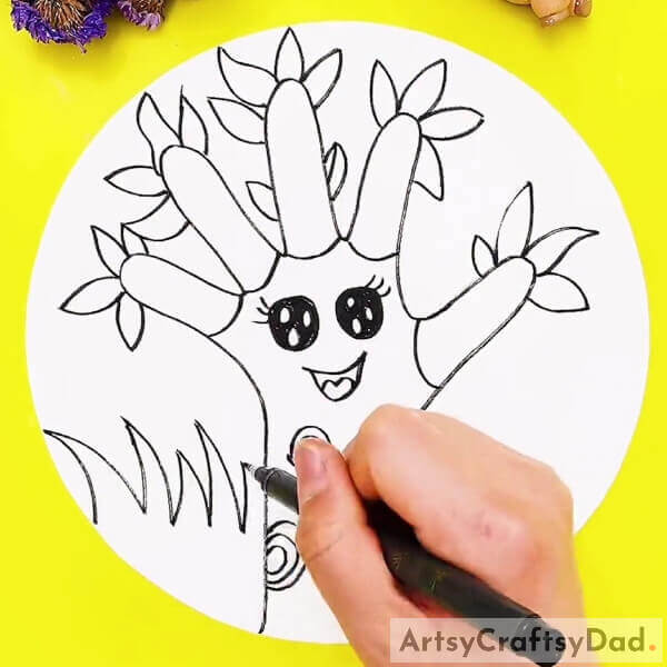 Drawing The Leaves And Grass- A step-by-step guide for newbies on how to draw a pleasant tree using a hand outline. 