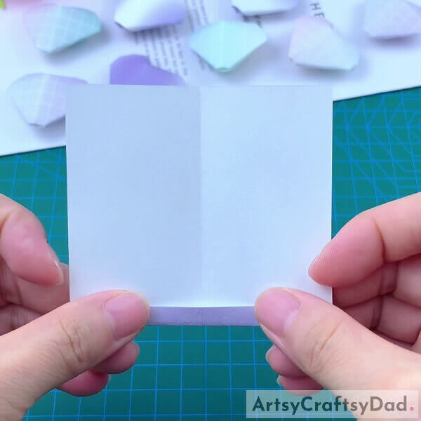 Folding Few Inches Of Origami Paper Inside- Tutorial for kids on how to make a paper heart origami