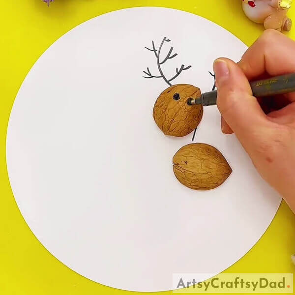 Making Eyes Of the Reindeer- Making a Walnut Shell Reindeer with Youngsters