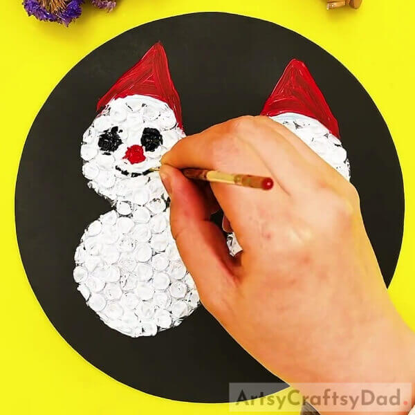 Making Nose And Smile On The Snowmen-Beautiful Snowman Painting Craft Using Bubble Wrap Tutorial For Kids