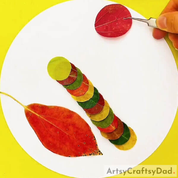 Making Sun Out Of Leaf- Learn to create a caterpillar over leaf scenery